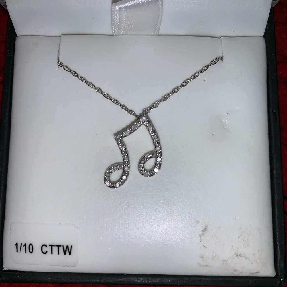 Diamond muscle note necklace